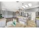 Spacious kitchen with an island, stainless steel appliances, and dining area at 3112 Haddon Dr, Las Vegas, NV 89134