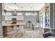 Bright kitchen with granite countertops, stainless steel appliances, and breakfast bar at 3112 Haddon Dr, Las Vegas, NV 89134