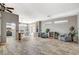 Open-concept living room with wood-look floors, fireplace, and views of the kitchen at 3112 Haddon Dr, Las Vegas, NV 89134