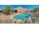 Inviting backyard pool with mature landscaping and lounge area is ideal for entertaining at 3112 Haddon Dr, Las Vegas, NV 89134