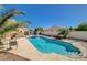 Inviting backyard pool and spa with views of the surrounding greenery and blue sky at 3112 Haddon Dr, Las Vegas, NV 89134