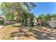 Spacious backyard featuring a decorative wrought iron arbor and mature landscaping at 3158 La Luna Cir, Henderson, NV 89014