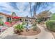 Backyard with a fountain, outdoor seating, and lush landscaping for relaxing and entertaining at 3158 La Luna Cir, Henderson, NV 89014