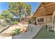 Backyard showcasing covered patio, lush landscaping, and a covered pool at 3158 La Luna Cir, Henderson, NV 89014