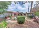 Expansive backyard featuring a fountain, mature landscaping, and outdoor seating area, perfect for entertaining at 3158 La Luna Cir, Henderson, NV 89014