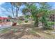 Large backyard featuring mature trees, landscaping, and various outdoor spaces to enjoy nature at 3158 La Luna Cir, Henderson, NV 89014