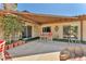Back patio area with outdoor seating, a covered patio, and access to the pool at 3158 La Luna Cir, Henderson, NV 89014