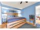Comfortable bedroom featuring a closet, hardwood floors, and natural lighting at 3158 La Luna Cir, Henderson, NV 89014
