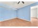 Bedroom featuring blue walls and hardwood floors with access to the next room at 3158 La Luna Cir, Henderson, NV 89014