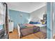 Bedroom with wood floor, big window, closet and white dresser at 3158 La Luna Cir, Henderson, NV 89014
