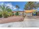 Charming single-story home with desert landscaping, shade covering, and an attached two-car garage at 3158 La Luna Cir, Henderson, NV 89014