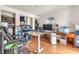Home office with a workspace, closet, large window, and ample natural light on hardwood floors at 3158 La Luna Cir, Henderson, NV 89014