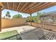 A covered patio area with shade, adjacent to a block wall for privacy at 3158 La Luna Cir, Henderson, NV 89014