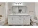 Bathroom features a white vanity with a large mirror and modern lighting at 3400 Cabana Dr # 1048, Las Vegas, NV 89122