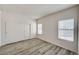 Bedroom featuring spacious closet with shelving, window, modern flooring, and neutral color palette at 3400 Cabana Dr # 1048, Las Vegas, NV 89122