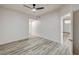 Spacious bedroom featuring wood-look floors and modern ceiling fan at 3400 Cabana Dr # 1048, Las Vegas, NV 89122