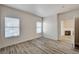 Bright bedroom with wood-look flooring and natural light from two windows at 3400 Cabana Dr # 1048, Las Vegas, NV 89122