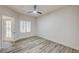An airy bedroom with wood-look flooring and a door to a patio at 3400 Cabana Dr # 1048, Las Vegas, NV 89122