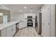 Corner kitchen with stainless appliances, white cabinets, and solid countertops at 3400 Cabana Dr # 1048, Las Vegas, NV 89122