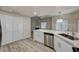 Corner kitchen with solid countertops and view to fireplace and living room at 3400 Cabana Dr # 1048, Las Vegas, NV 89122