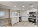 Kitchen with breakfast bar, stainless appliances, and bright natural light from windows at 3400 Cabana Dr # 1048, Las Vegas, NV 89122