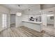 Modern kitchen features stainless appliances, white cabinets, and a large breakfast bar at 3400 Cabana Dr # 1048, Las Vegas, NV 89122