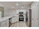 Kitchen features stainless appliances, white cabinets and solid surface countertops at 3400 Cabana Dr # 1048, Las Vegas, NV 89122