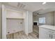 Laundry room with folding doors and wire shelving at 3400 Cabana Dr # 1048, Las Vegas, NV 89122