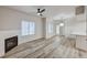 Spacious living room boasts a fireplace, ceiling fan, and adjoins the kitchen area at 3400 Cabana Dr # 1048, Las Vegas, NV 89122