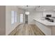 Bright living room with adjacent kitchen and access to a patio with white window at 3400 Cabana Dr # 1048, Las Vegas, NV 89122