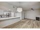 Open-concept living space with kitchen, fireplace and modern lighting at 3400 Cabana Dr # 1048, Las Vegas, NV 89122
