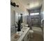 Stylish bathroom with marble countertop, under-mount sink, shower-tub, and modern fixtures at 3791 Soplo Rd, Pahrump, NV 89048