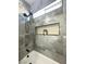 Modern bathroom boasts a sleek shower head, black fixtures, and decorative shelf insert at 3791 Soplo Rd, Pahrump, NV 89048