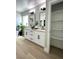 Bright bathroom featuring double vanity, modern fixtures, and tiled floors at 3791 Soplo Rd, Pahrump, NV 89048