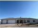 Beautiful single story home with a three car garage, desert landscaping, and a tile roof at 3791 Soplo Rd, Pahrump, NV 89048