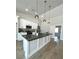 Bright kitchen with a large center island, stainless appliances, and pendant lighting at 3791 Soplo Rd, Pahrump, NV 89048