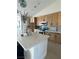 Bright kitchen featuring a large island with counter seating, pendant lights, and custom cabinetry at 3791 Soplo Rd, Pahrump, NV 89048