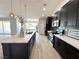 Modern kitchen with dark cabinets, an island, and stainless steel appliances at 3791 Soplo Rd, Pahrump, NV 89048