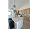 Bright kitchen featuring a large island with counter seating, pendant lights, and custom cabinetry at 3791 Soplo Rd, Pahrump, NV 89048