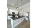 Bright kitchen with a large center island, stainless appliances, and pendant lighting at 3791 Soplo Rd, Pahrump, NV 89048