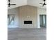 Spacious living room featuring a fireplace with light hardwood paneling and hardwood floors at 3791 Soplo Rd, Pahrump, NV 89048