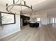 Open concept living space featuring modern lighting, flooring and kitchen area at 3791 Soplo Rd, Pahrump, NV 89048