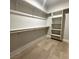 Spacious walk-in closet with built-in shelving and wooden floors at 3791 Soplo Rd, Pahrump, NV 89048