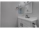Bright bathroom featuring a single sink vanity, modern fixtures, and neutral decor at 394 Lombardy Cir, Henderson, NV 89015