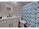 Clean bathroom featuring a single sink vanity, with a classic framed mirror and a shower/tub combo at 394 Lombardy Cir, Henderson, NV 89015