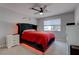 Modern bedroom with a tufted headboard, stylish lighting, and a neutral color scheme at 394 Lombardy Cir, Henderson, NV 89015