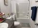 Clean and functional bathroom with a shower-tub combo, and modern fixtures at 411 Hellebores Ave, North Las Vegas, NV 89084