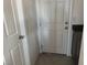 Hallway with a door and granite countertops at 411 Hellebores Ave, North Las Vegas, NV 89084