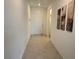 Bright hallway featuring neutral paint and flooring leads to living areas at 411 Hellebores Ave, North Las Vegas, NV 89084