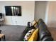 Comfortable leather couch with decorative pillows in a cozy living room setting at 411 Hellebores Ave, North Las Vegas, NV 89084